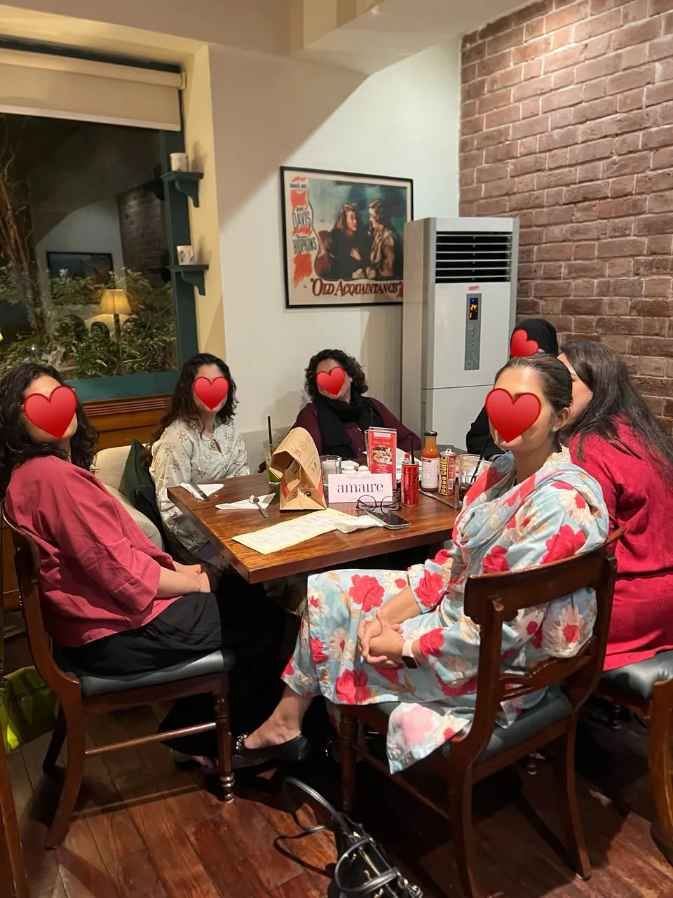Amaire guests gathered together around a dinner table